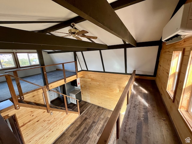 bedroom featuring hardwood / wood-style flooring, wood walls, and vaulted ceiling with beams