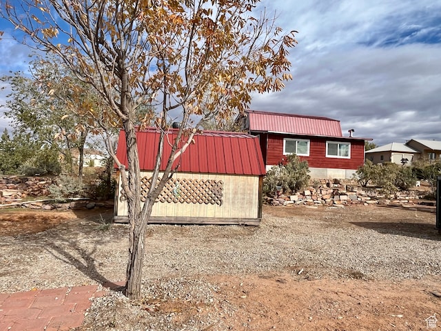 view of side of property with a shed