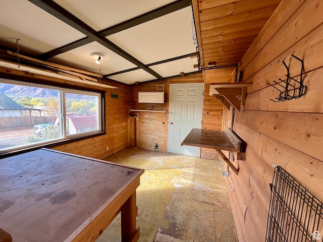 interior space featuring wood walls and vaulted ceiling