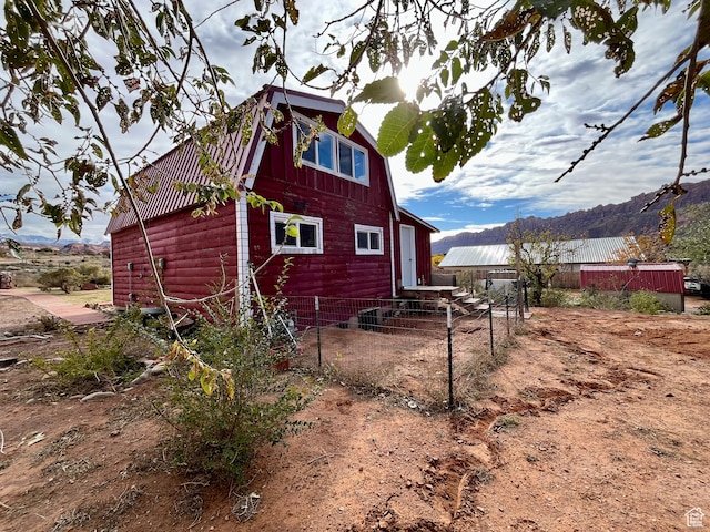 view of side of property with a mountain view