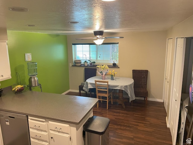 633 E 6910 S, Midvale, UT 84047 - kitchen featuring dishwasher, white cabinetry, ceiling fan, dark wood-style floors, and baseboards