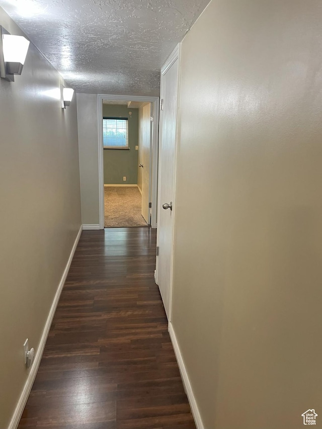 633 E 6910 S, Midvale, UT 84047 - corridor with dark wood-type flooring, baseboards, and a textured ceiling