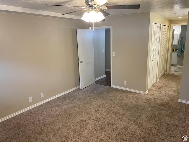 633 E 6910 S, Midvale, UT 84047 - unfurnished bedroom with carpet, a textured ceiling, baseboards, and a ceiling fan
