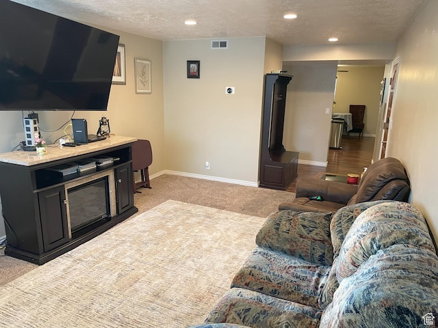 633 E 6910 S, Midvale, UT 84047 - living area with a textured ceiling, light colored carpet, baseboards, and recessed lighting