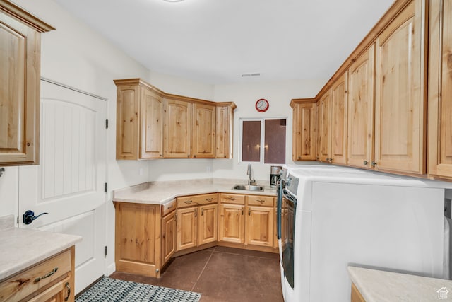 896 E Mesa Vista Dr, Ivins, UT 84738 - laundry area with cabinets, sink, dark tile patterned floors, and washer / clothes dryer