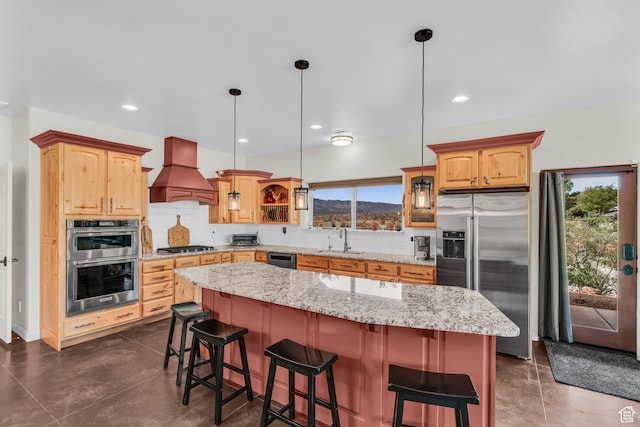 896 E Mesa Vista Dr, Ivins, UT 84738 - kitchen featuring appliances with stainless steel finishes, custom range hood, a kitchen island, pendant lighting, and decorative backsplash