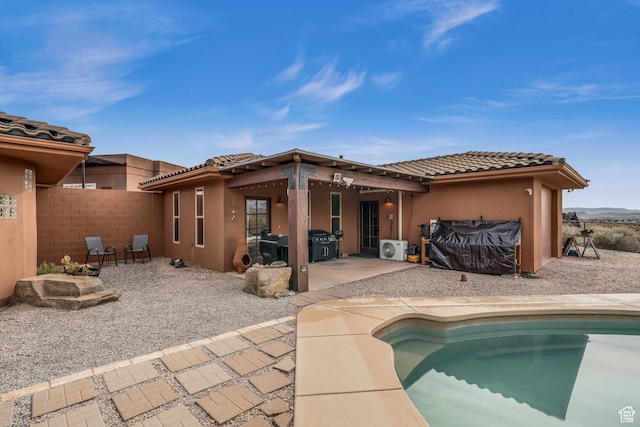 896 E Mesa Vista Dr, Ivins, UT 84738 - rear view of house with a fenced in pool and a patio area