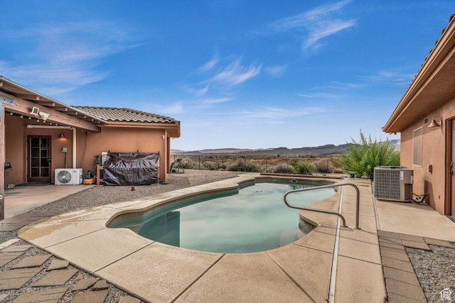 896 E Mesa Vista Dr, Ivins, UT 84738 - view of swimming pool featuring a mountain view, central AC unit, ac unit, and a patio