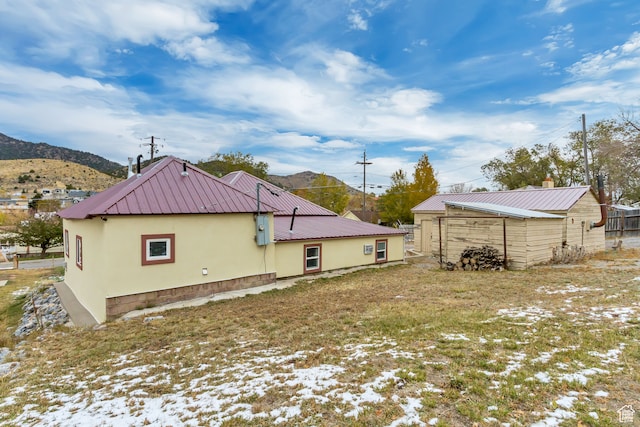 view of side of property with a mountain view