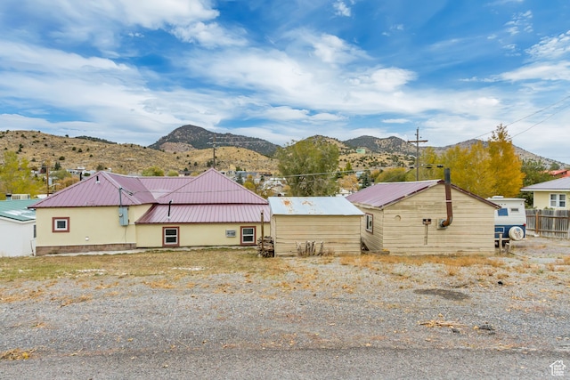view of property exterior featuring a mountain view