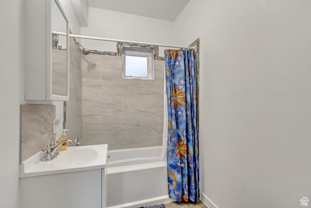 bathroom featuring sink and shower / bathtub combination with curtain