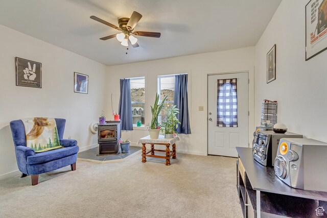 11 W Main St, Eureka, UT 84628 - carpeted foyer with a wood stove, ceiling fan, and baseboards