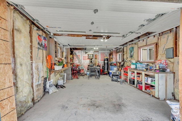 11 W Main St, Eureka, UT 84628 - garage featuring a workshop area and water heater