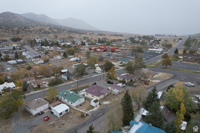 birds eye view of property featuring a mountain view