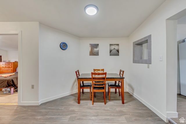 dining space featuring hardwood / wood-style flooring