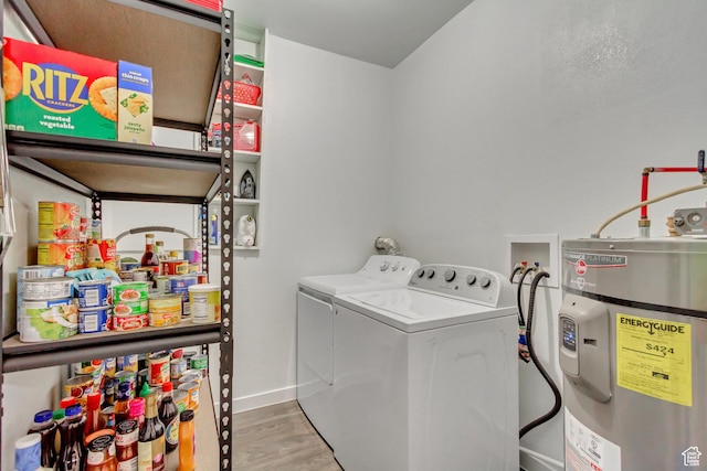 11 W Main St, Eureka, UT 84628 - laundry room featuring strapped water heater, wood finished floors, baseboards, and washing machine and dryer