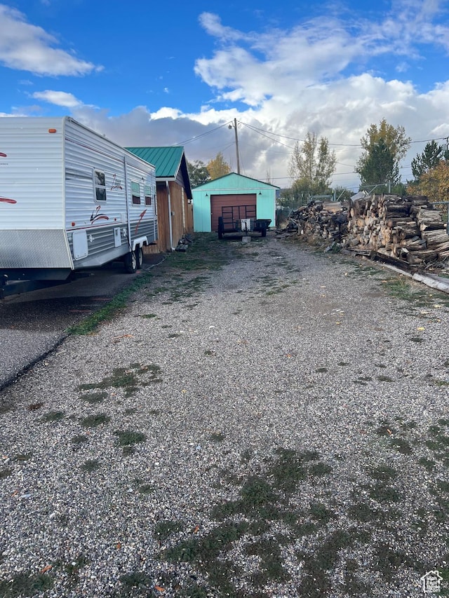 view of outbuilding featuring an outbuilding and driveway