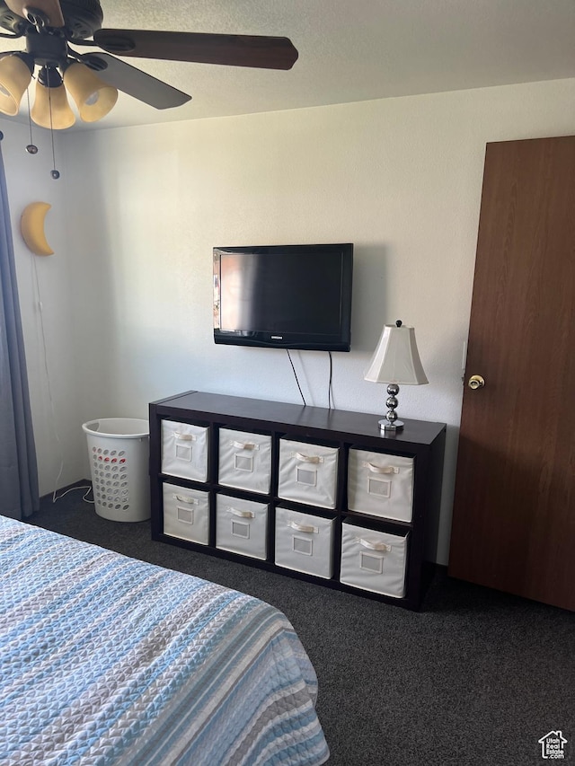 bedroom with a ceiling fan and carpet floors