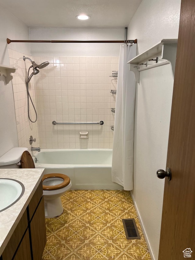 full bathroom featuring toilet, vanity, visible vents, and shower / tub combo with curtain