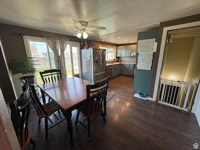 dining area featuring recessed lighting, a ceiling fan, a textured ceiling, and dark wood-style flooring