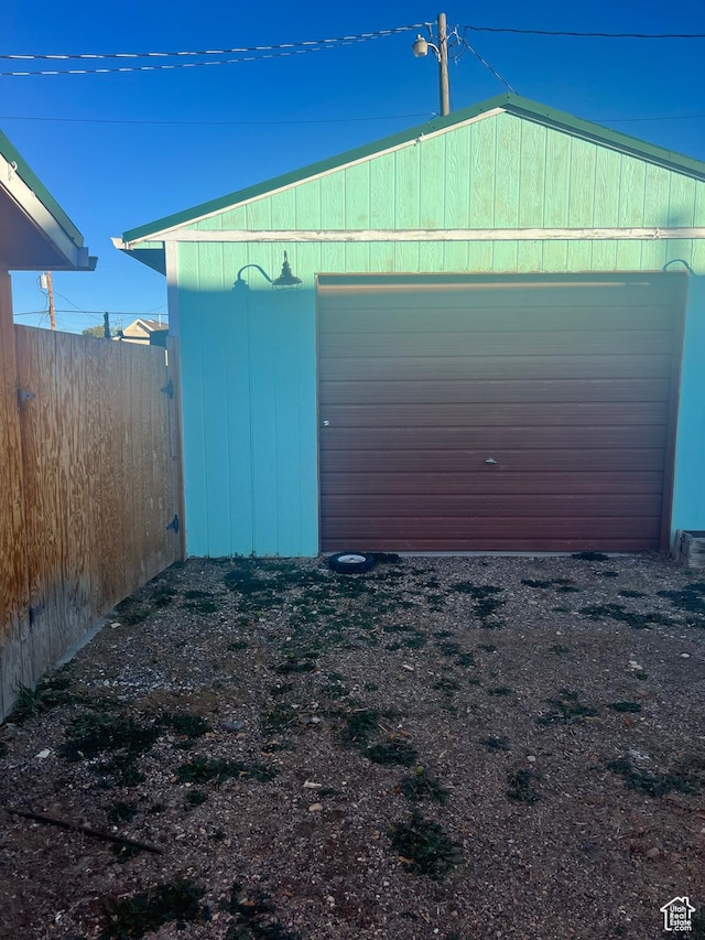 garage with fence