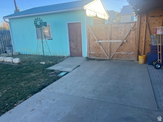 view of outdoor structure with a gate and fence