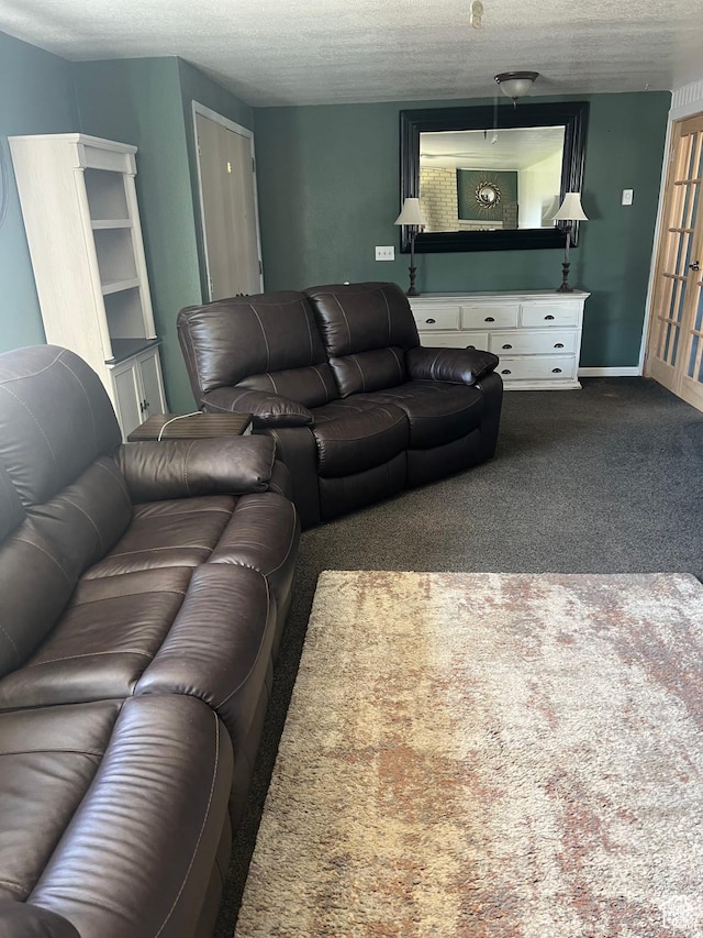 living area with a textured ceiling and carpet