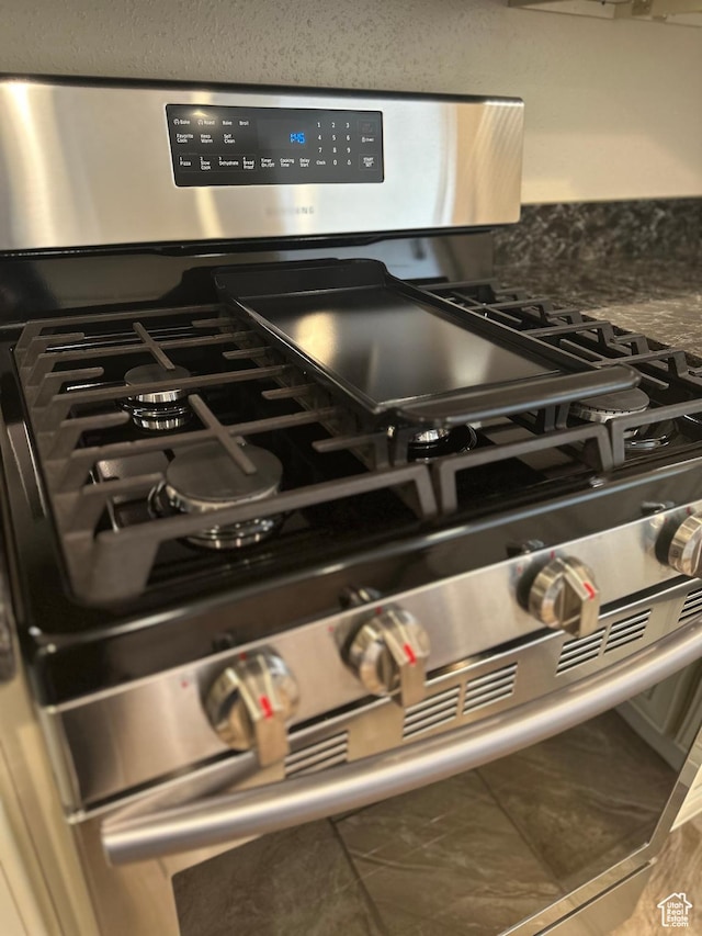 kitchen view of stainless steel range with gas stovetop