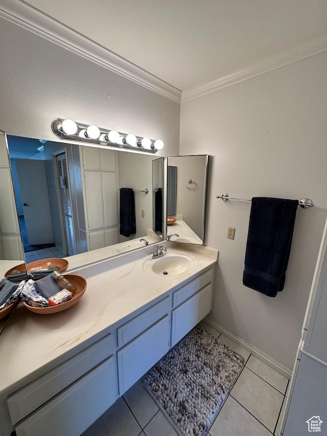 full bathroom featuring crown molding, tile patterned floors, and vanity