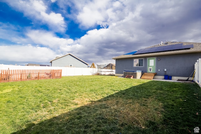 view of yard with a hot tub