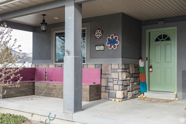 property entrance with covered porch