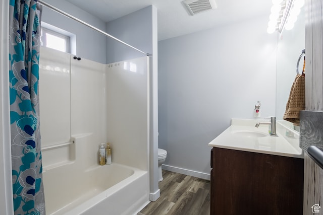 full bathroom with wood-type flooring, vanity, toilet, and shower / bath combo