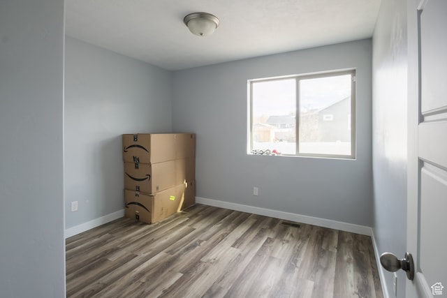 unfurnished bedroom with wood-type flooring