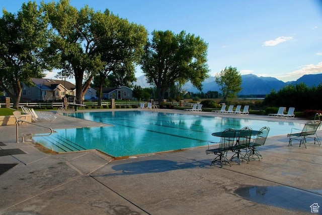 231 S Wiltshire Ln, Saratoga Springs, UT 84045 - community pool featuring a patio area and a mountain view