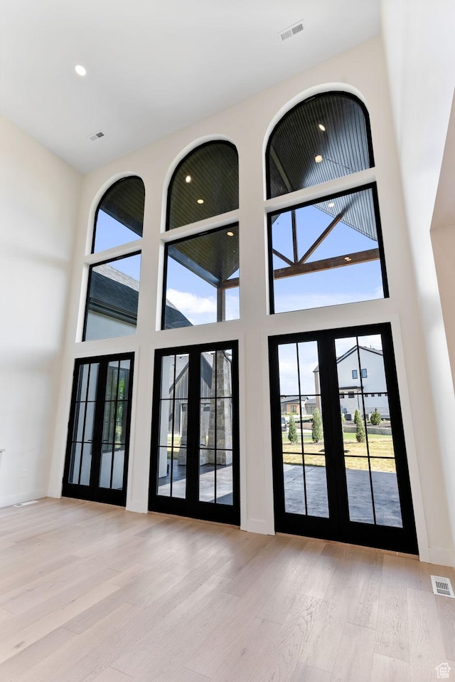 231 S Wiltshire Ln, Saratoga Springs, UT 84045 - doorway with wood finished floors, a towering ceiling, and recessed lighting