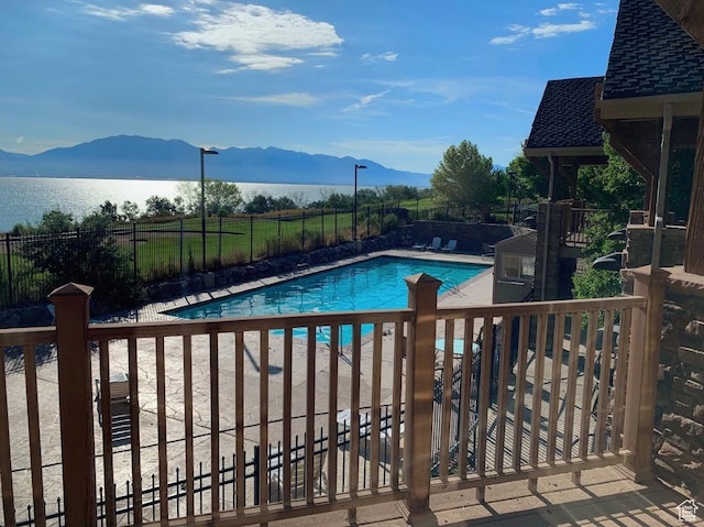 231 S Wiltshire Ln, Saratoga Springs, UT 84045 - community pool featuring fence, a water and mountain view, and a patio