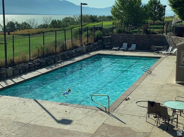 231 S Wiltshire Ln, Saratoga Springs, UT 84045 - view of pool with a patio, a fenced backyard, and a mountain view