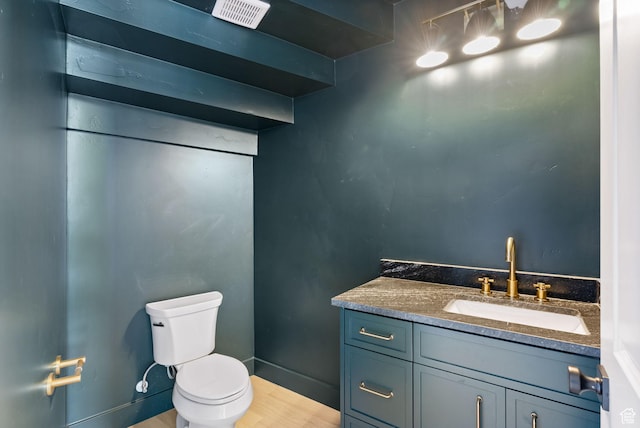 231 S Wiltshire Ln, Saratoga Springs, UT 84045 - bathroom with toilet, vanity, and wood finished floors