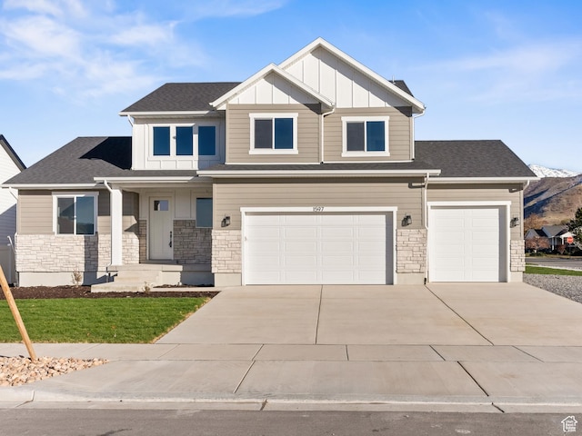 1597 S 1100 W, Payson, UT 84651 - craftsman-style home featuring concrete driveway, a garage, stone siding, board and batten siding, and a front lawn