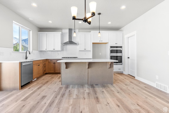 1597 S 1100 W, Payson, UT 84651 - kitchen with wall chimney exhaust hood, appliances with stainless steel finishes, a kitchen island, backsplash, and a sink