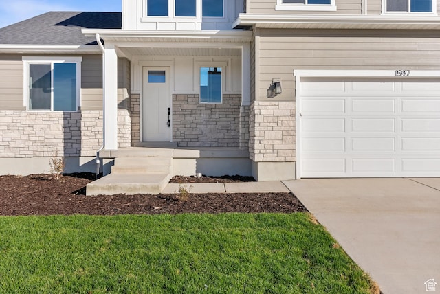 1597 S 1100 W, Payson, UT 84651 - property entrance featuring stone siding, a garage, and concrete driveway