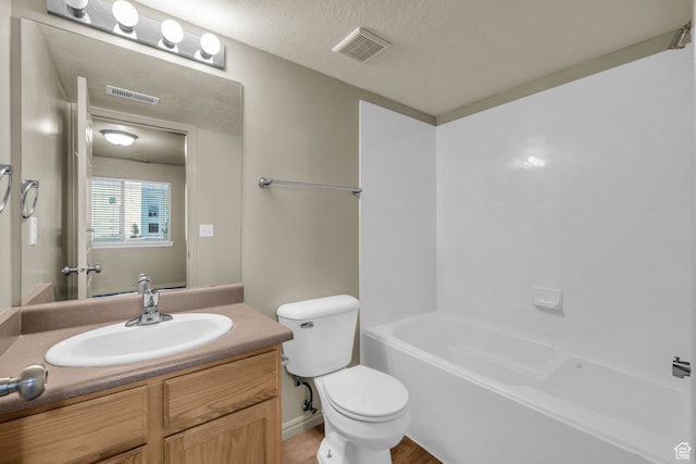 929 W 670 S Unit 1, Pleasant Grove, UT 84062 - full bathroom with toilet, hardwood / wood-style floors, washtub / shower combination, a textured ceiling, and vanity