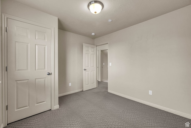 929 W 670 S Unit 1, Pleasant Grove, UT 84062 - unfurnished bedroom featuring a textured ceiling and light carpet