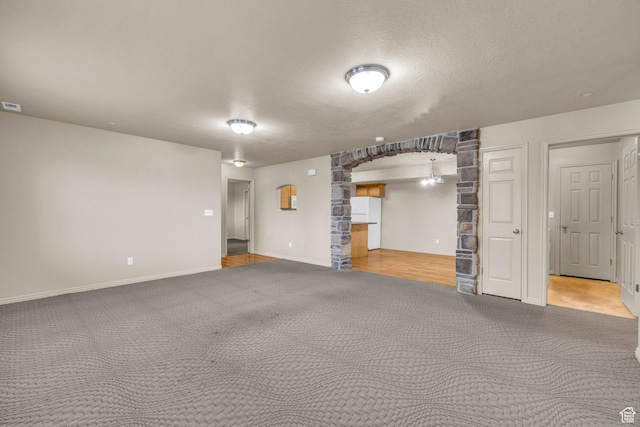 929 W 670 S Unit 1, Pleasant Grove, UT 84062 - unfurnished living room featuring carpet and a textured ceiling