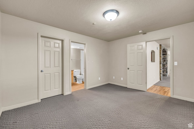 929 W 670 S Unit 1, Pleasant Grove, UT 84062 - unfurnished bedroom with a closet, a textured ceiling, carpet floors, and ensuite bath