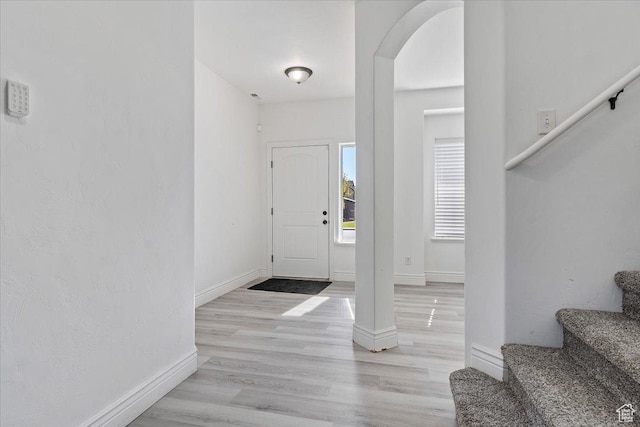 787 E 1950 S, Lehi, UT 84043 - foyer with arched walkways, stairway, baseboards, and wood finished floors