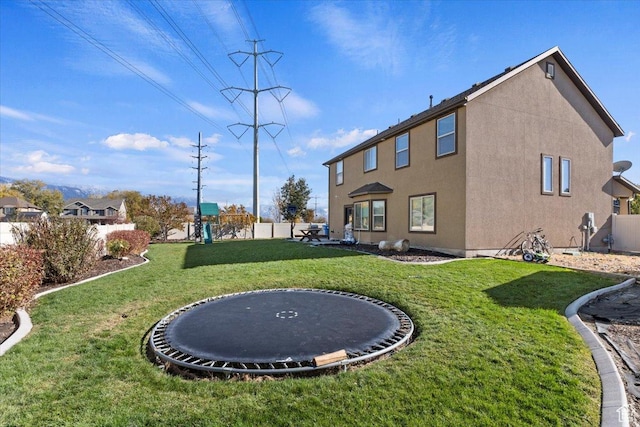 787 E 1950 S, Lehi, UT 84043 - back of property with a trampoline and stucco siding
