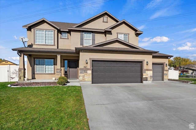 787 E 1950 S, Lehi, UT 84043 - view of front facade with stone siding, stucco siding, driveway, and a garage