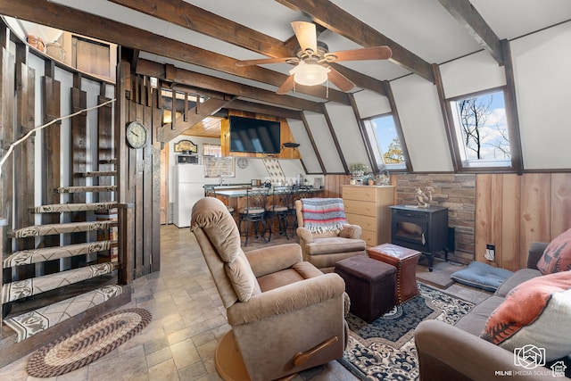 780 W Hillside Dr, Pine Valley, UT 84781 - living room featuring a wood stove, wood walls, ceiling fan, and beam ceiling