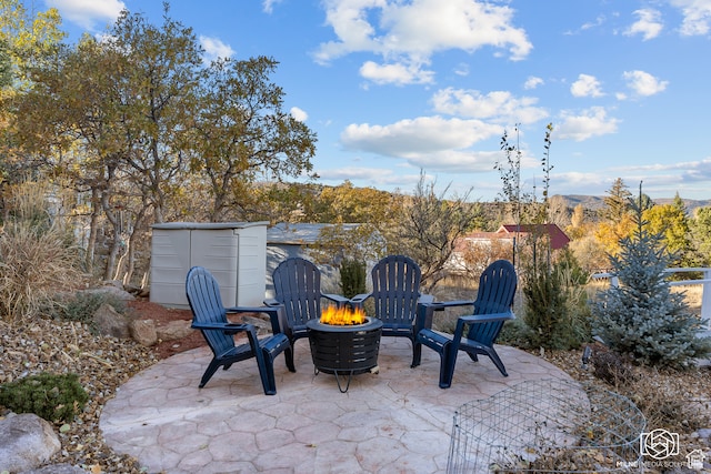 780 W Hillside Dr, Pine Valley, UT 84781 - view of patio / terrace with an outdoor fire pit and a storage unit